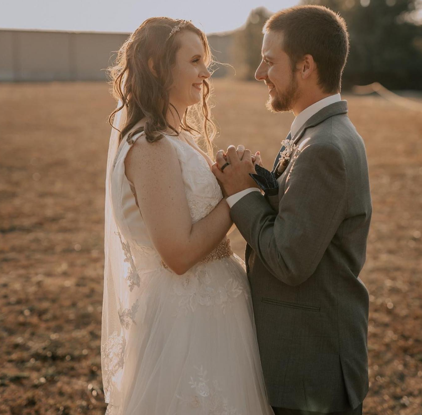 Bride and groom holding hands